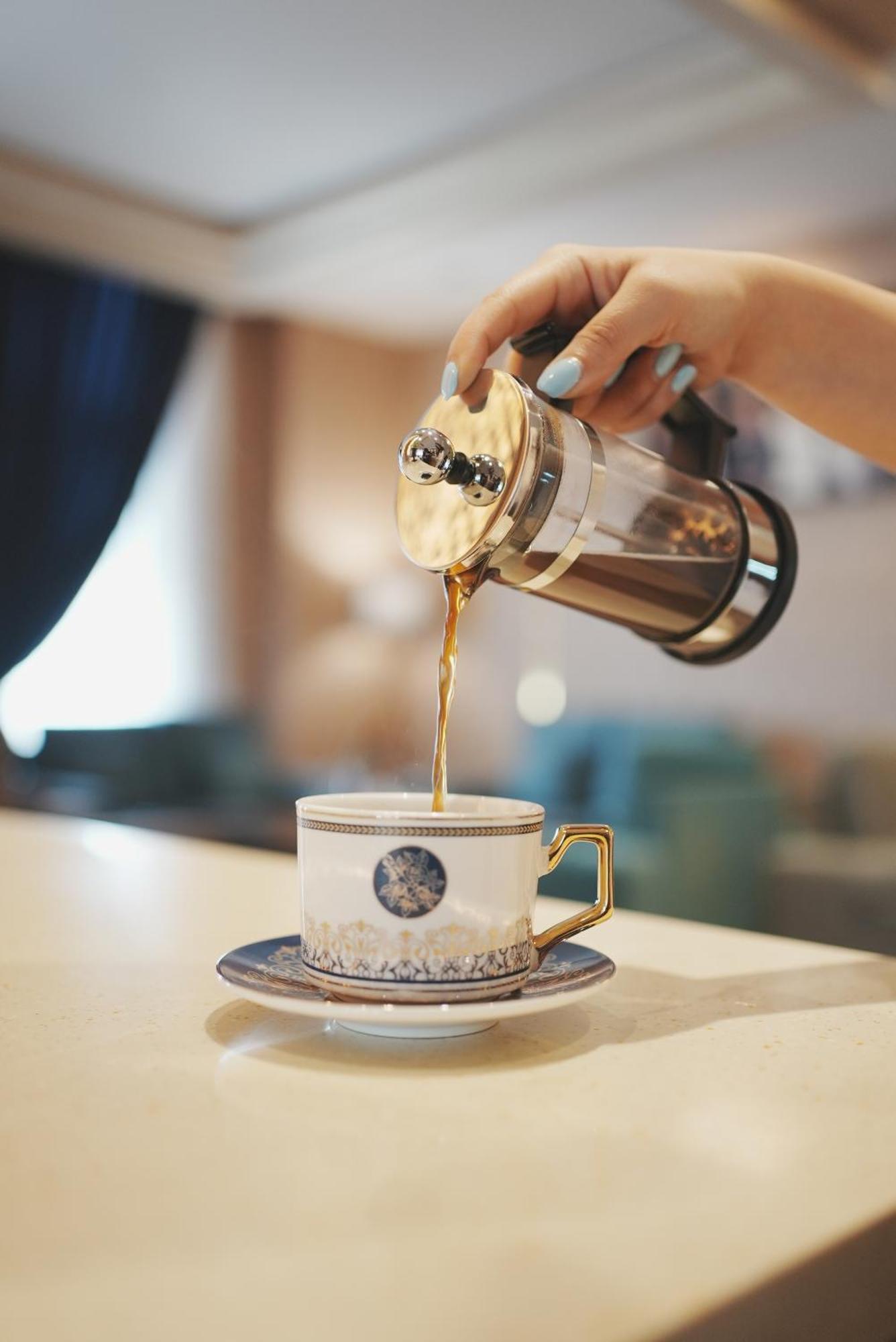 Thousand Nights Hotel Amman Luaran gambar Coffee being poured from a French press