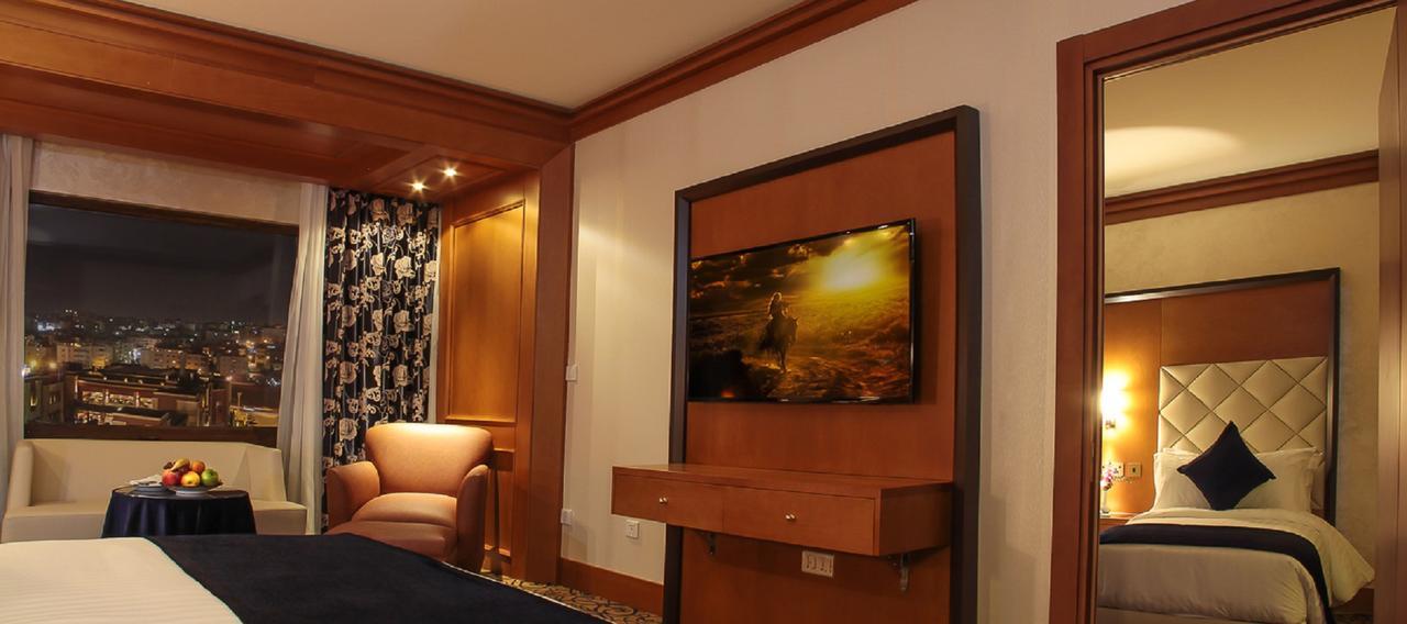 Thousand Nights Hotel Amman Luaran gambar A television in a hotel room